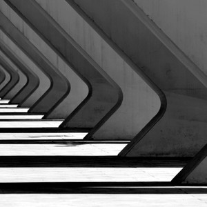 Intriguing black and white geometric architecture in València with striking shadows.